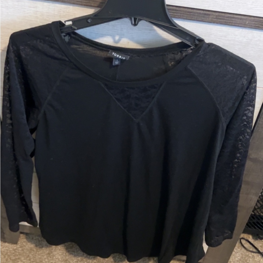 Black long sleeve, sleeves are lace.